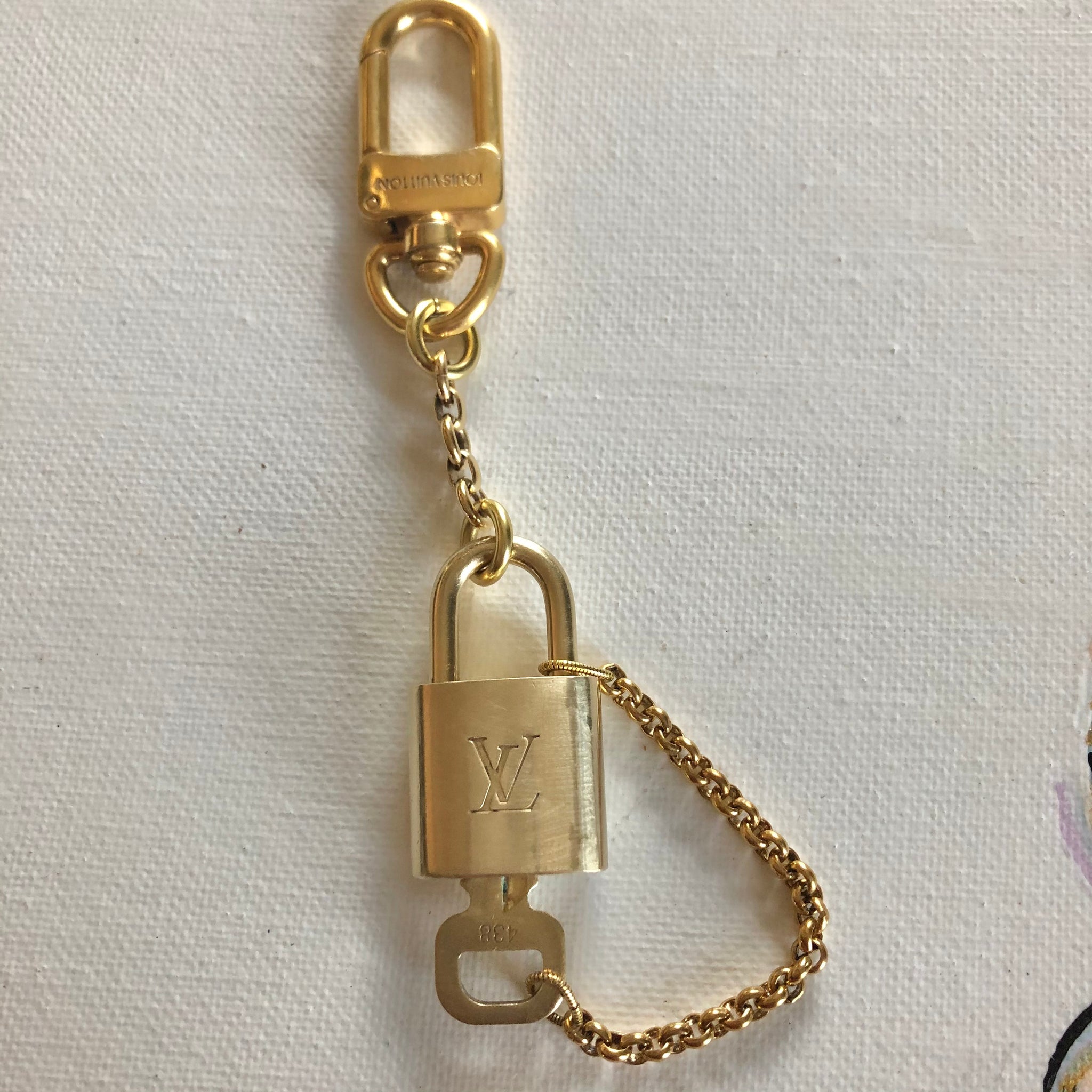 Authentic gold Louis Vuitton lock, was previously